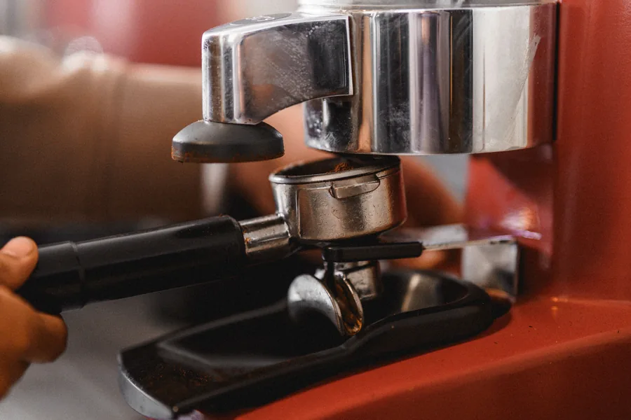 Coffee being ground into a portafilter.